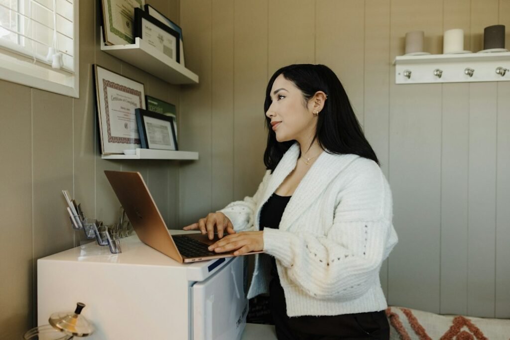 Small business owner planning a Google Ads budget on a laptop